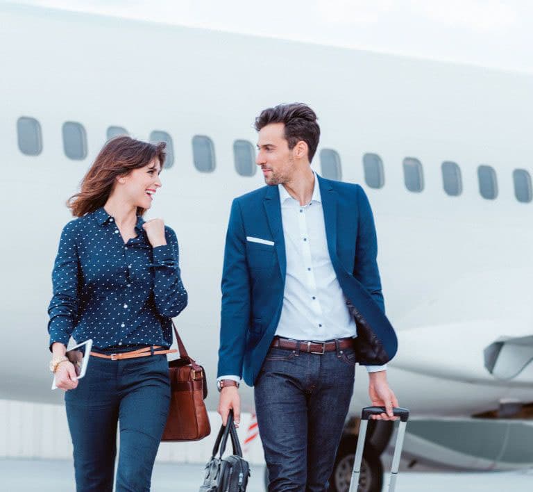 Two models getting off a plane