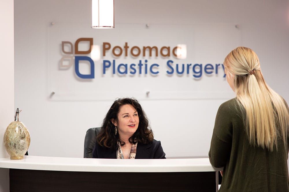 Potomac Plastic Surgery receptionist talking to patient
