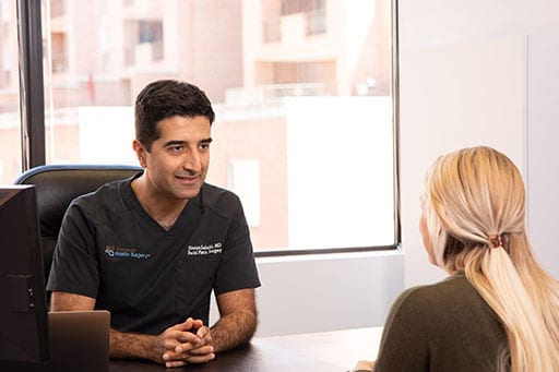 Dr. Chaboki and patient sitting across from each other