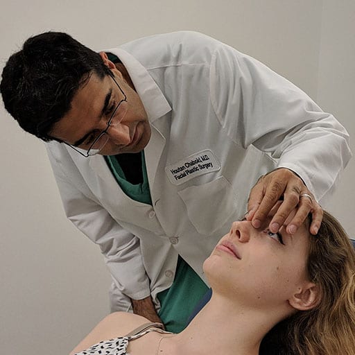 Dr. Chaboki pinching upper nasal cavity of patient
